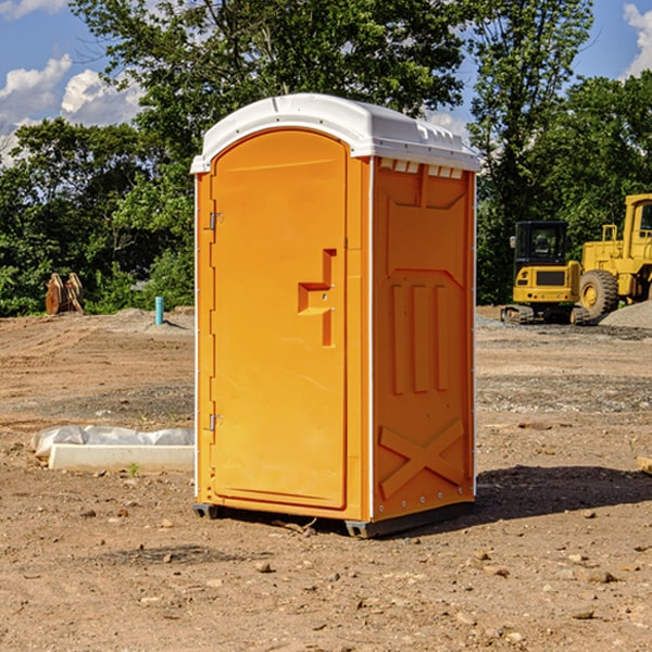 what is the cost difference between standard and deluxe portable restroom rentals in Okemah